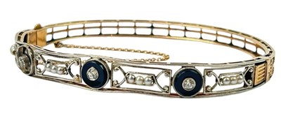 Lot 250 - A Diamond & Seed Pearl Hinged Bangle.