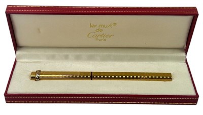 Lot 150 - Les Must De Cartier Gold tone Ball Point Pen.