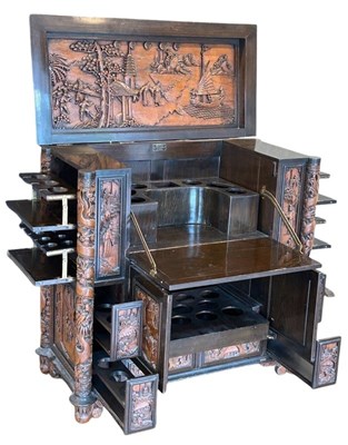 Lot 122 - Carved Teak Drinks Cabinet.