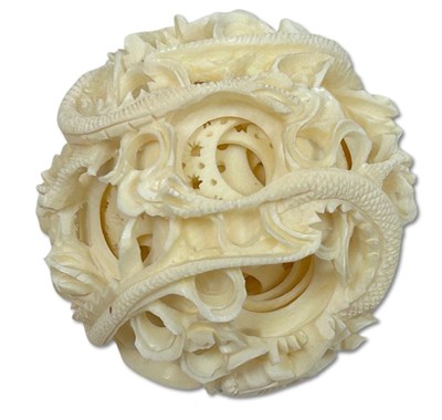 Lot 156 - Intricately Carved Ivory Dragon Puzzle Ball with Stand.