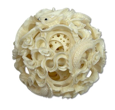 Lot 156 - Intricately Carved Ivory Dragon Puzzle Ball with Stand.