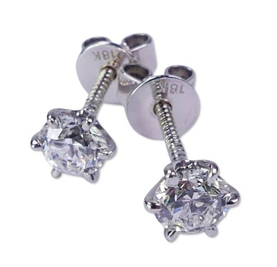 Lot 228 - A Pair of Round Brilliant Cut Diamond Studs.