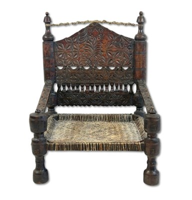 Lot 125 - Hand Carved Traditional Low Chair.