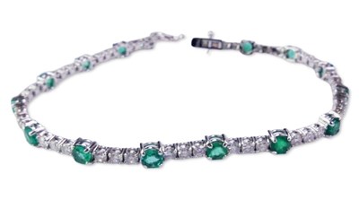Lot 282 - Emerald and Diamond Tennis Bracelet.