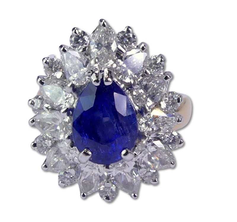 Lot 244 - Sapphire and Diamond Basket-Style Cluster Ring.