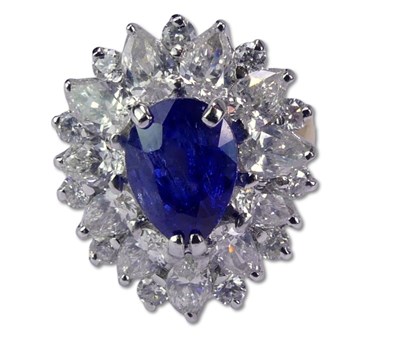 Lot 244 - Sapphire and Diamond Basket-Style Cluster Ring.