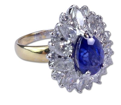 Lot 244 - Sapphire and Diamond Basket-Style Cluster Ring.
