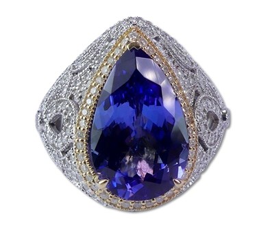 Lot 232 - Tanzanite and Diamond Halo Ring.