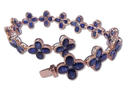 Lot 278 - Sapphire and Diamond Floral Design Bracelet.