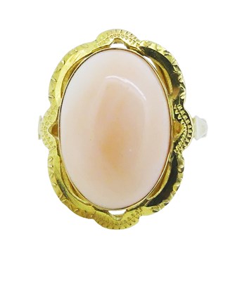 Lot 180 - A Yellow Gold Coral Ring.