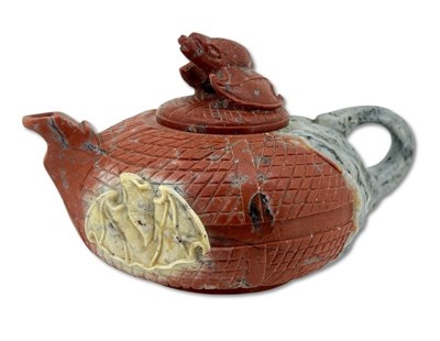 Lot 207 - An Intricately Carved Stone Teapot.