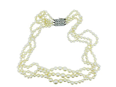 Lot 210 - A Quality Pearl and Diamond String.