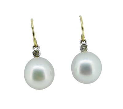 Lot 76 - Linneys South Sea Pearl and Diamond Drop Earrings.