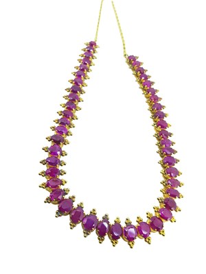 Lot 27 - Yellow Gold Ruby Necklace.