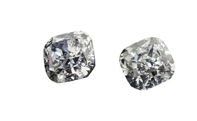 Lot 103 - Two Cushion Cut Unset Diamonds.