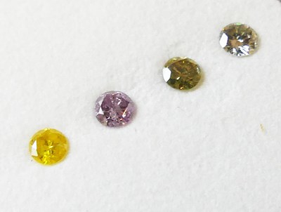 Lot 126 - Four Unset Fancy Coloured Diamonds.