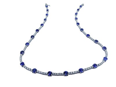 Lot 77 - Diamond and Sapphire Tennis Style Necklace.