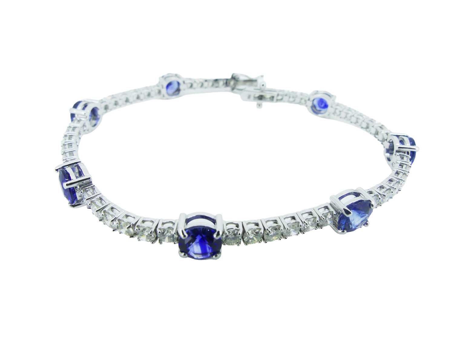 Lot 81 - Sapphire and Diamond Tennis Bracelet.