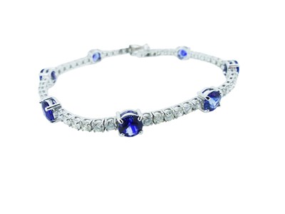 Lot 81 - Sapphire and Diamond Tennis Bracelet.