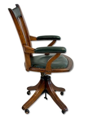 Lot 145 - Walnut Swivel Arrow Back Office Chair.