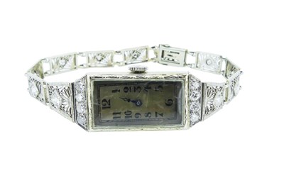 Lot 15 - A White Gold Bracelet Watch.