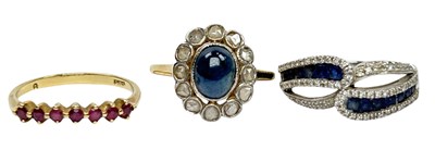 Lot 239 - Three Gold Gem Set Rings.