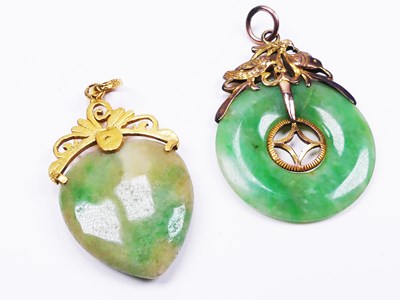 Lot 267 - Two Small Jade Pendants set in Gold.