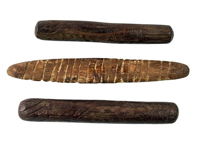 Lot 74 - Two wooden singing sticks and Message stick.