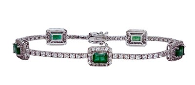 Lot 230 - Dazzling 18ct White Gold Diamond & Emerald Bracelet.