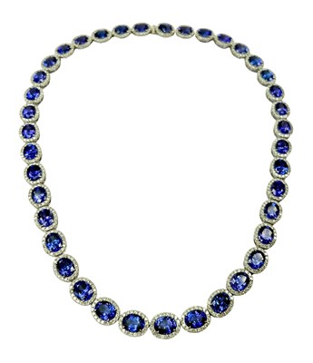 Lot 253 - 14ct White Gold Tanzanite & Diamond Necklace.